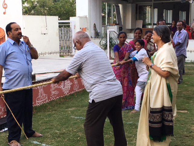 Residents and staff playing games at SMILES . 