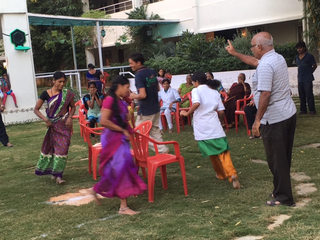 Residents and staff playing games at SMILES . 