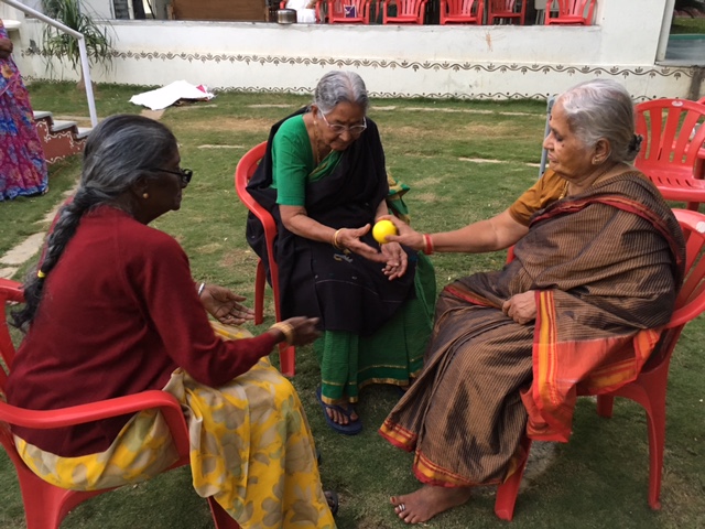 Residents and staff playing games at SMILES . 