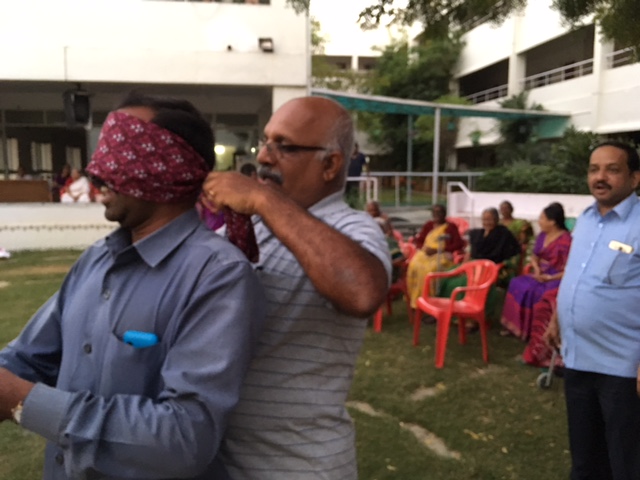 Residents and staff playing games at SMILES . 