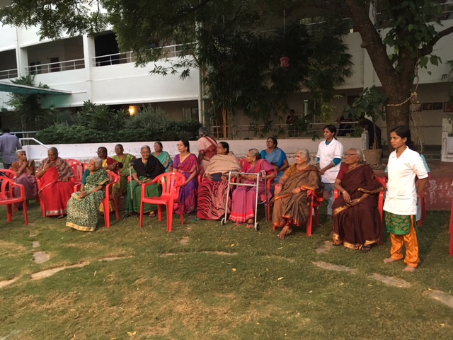 Residents and staff playing games at SMILES . 