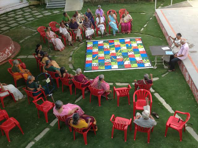 SNAKES AND LADDERS GAME PLAYED BY RESIDENTS AND EMPLOYEES at SMILES 